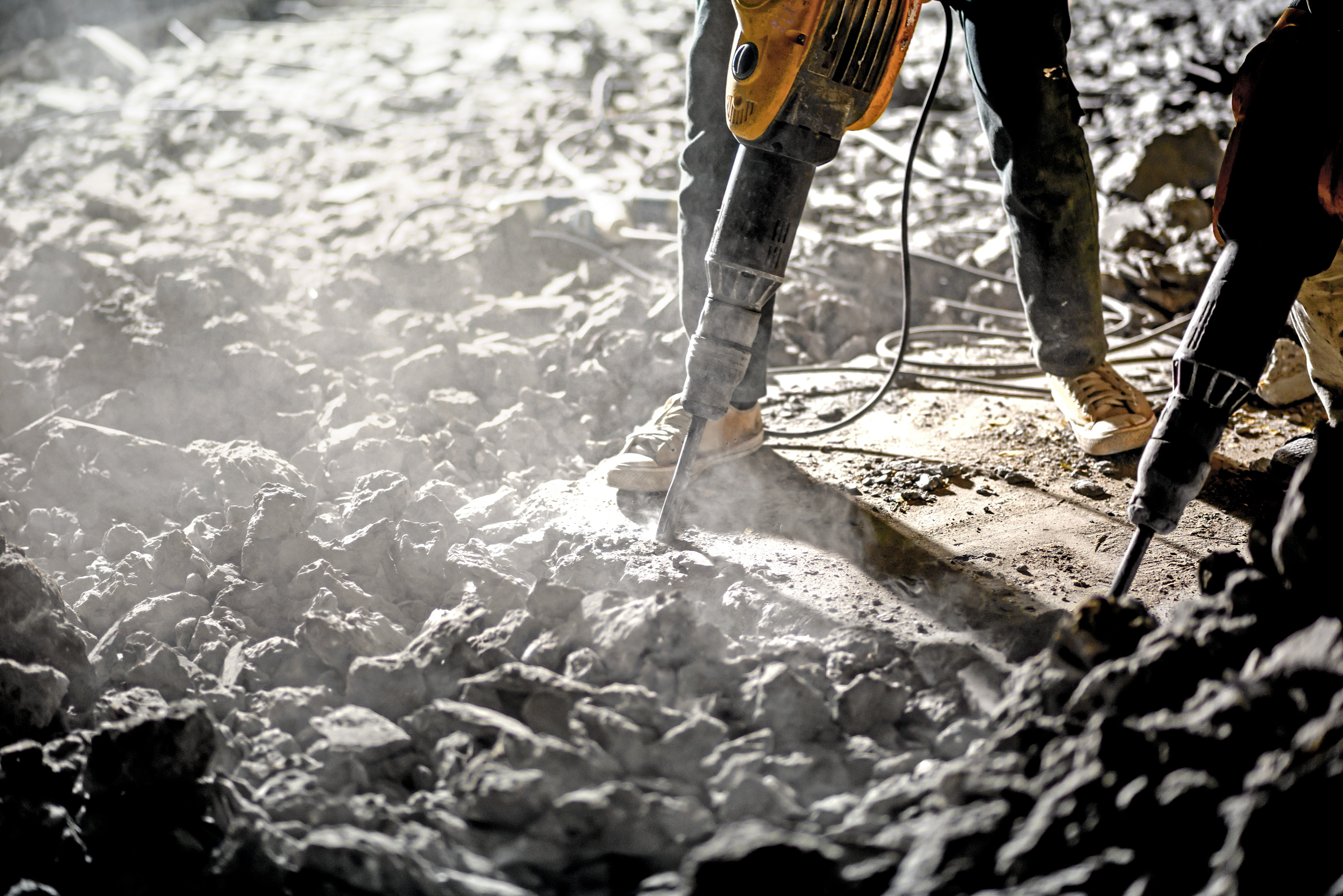 Road repairing works with jackhammer at night